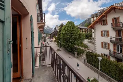 a view of a street from a balcony of a building at Paccard: Residence Le Lutetia in Chamonix-Mont-Blanc