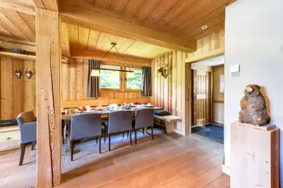 a dining room with a table and chairs at Chalet Noemie in Les Houches