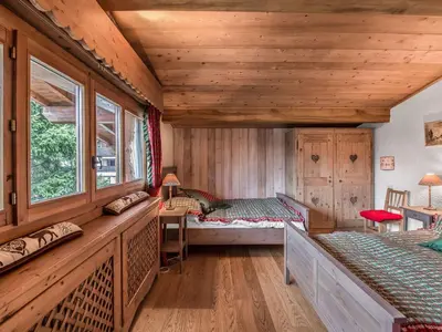 a room with two beds and a window at Appartement 3 chambres rénové à Megève - FR-1-453-6 in Megève