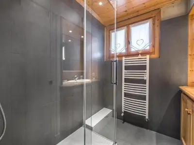 a glass shower in a bathroom with a sink at Appartement 3 chambres rénové à Megève - FR-1-453-6 in Megève