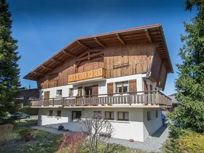 a house with a wooden roof at Appartement 3 chambres rénové à Megève - FR-1-453-6 in Megève