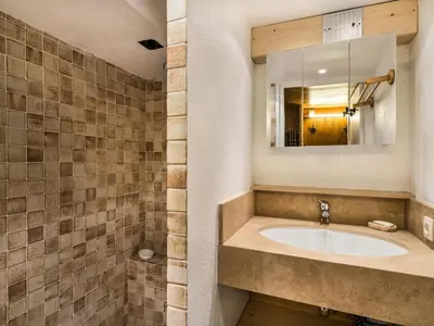 a bathroom with a sink and a mirror at Chalet 4 chambres à Megève Mont d'Arbois - 10 pers, terrasse, parking - FR-1-453-10 in Megève