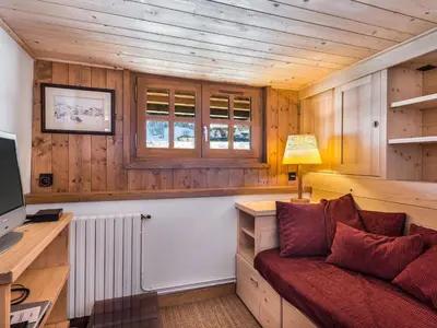 a living room with a couch and a desk at Chalet 4 chambres à Megève Mont d'Arbois - 10 pers, terrasse, parking - FR-1-453-10 in Megève