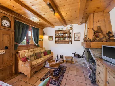 a living room with a couch and a fireplace at Appartement 4 chambres à Megève avec Wi-Fi et garage - FR-1-453-11 in Megève