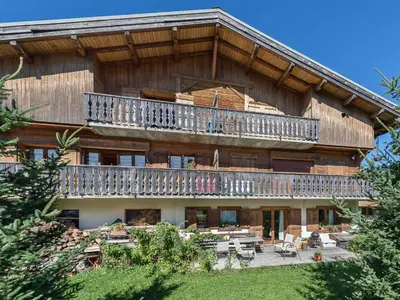 a large building with a balcony on top of it at Appartement 4 chambres à Megève avec Wi-Fi et garage - FR-1-453-11 in Megève