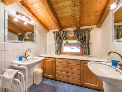 a bathroom with two sinks and a toilet at Appartement 4 chambres à Megève avec Wi-Fi et garage - FR-1-453-11 in Megève
