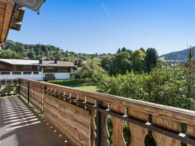 a wooden bridge with a view of a house at Appartement 4 chambres à Megève avec Wi-Fi et garage - FR-1-453-11 in Megève