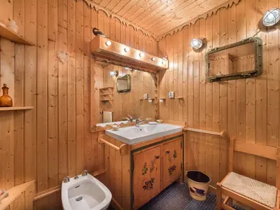 a wooden bathroom with a sink and a toilet at Appartement confortable 3 chambres proche centre Megève, balcon, cheminée, 8 pers. - FR-1-453-14 in Megève