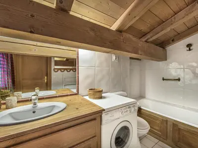 a bathroom with a sink and a washing machine at Appartement 3 chambres Megève Sud avec Balcon et Wifi - FR-1-453-28 in Megève