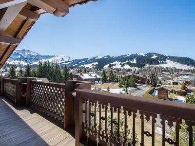 a view from the balcony of a home with snow covered mountains at Appartement 3 chambres Megève Sud avec Balcon et Wifi - FR-1-453-28 in Megève