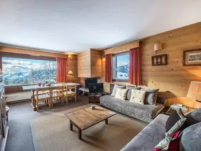 a living room with a couch and a table at Appartement 2 Chambres à Megève, Proche Pistes, WiFi - FR-1-453-32 in Megève