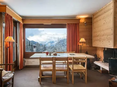 a dining room with a table and a large window at Appartement 2 Chambres à Megève, Proche Pistes, WiFi - FR-1-453-32 in Megève