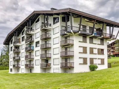 a building with balconies on the side of it at Appartement 2 Chambres à Megève, Proche Pistes, WiFi - FR-1-453-32 in Megève
