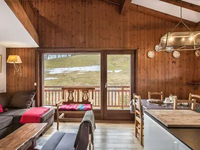 a living room with a couch and a table at Appartement 3 pièces Megève - Animaux admis, Parking inclus - FR-1-453-38 in Megève
