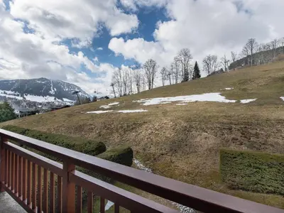 a wooden fence on a hill with snow on it at Appartement 3 pièces Megève - Animaux admis, Parking inclus - FR-1-453-38 in Megève