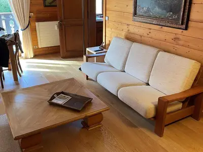 a living room with a couch and a table at Appartement cosy 2 chambres avec wifi à Megève - FR-1-453-48 in Megève