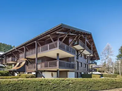 a large apartment building with balconies on it at Appartement cosy 2 chambres avec wifi à Megève - FR-1-453-48 in Megève