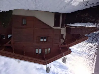 a reflection of a building in the snow at Duplex 3 Chambres à Megève - Confort et Wifi - FR-1-453-49 in Megève