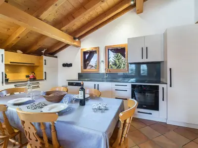a kitchen with a table and chairs in a room at Duplex 3 Chambres à Megève - Confort et Wifi - FR-1-453-49 in Megève