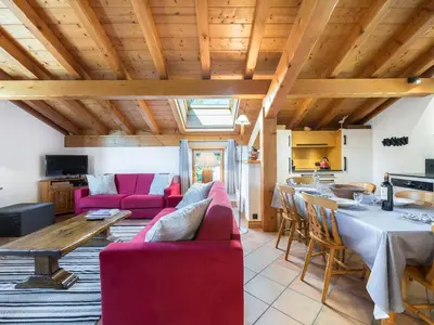 a living room with red furniture and a table at Duplex 3 Chambres à Megève - Confort et Wifi - FR-1-453-49 in Megève