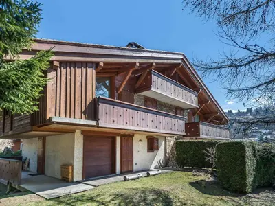 a wooden house with a balcony on top of it at Duplex 3 Chambres à Megève - Confort et Wifi - FR-1-453-49 in Megève