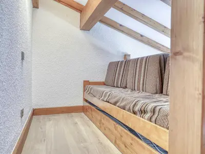 a couch in the corner of a room at Appartement cosy avec mezzanine, parking, 4 pers., proche télécabine à Megève - FR-1-453-51 in Megève