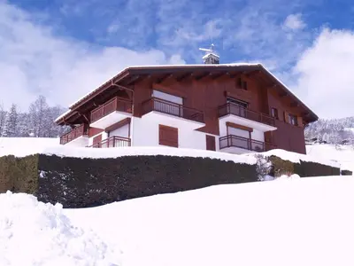 a large building in the snow with snow around it at Appartement cosy avec mezzanine, parking, 4 pers., proche télécabine à Megève - FR-1-453-51 in Megève