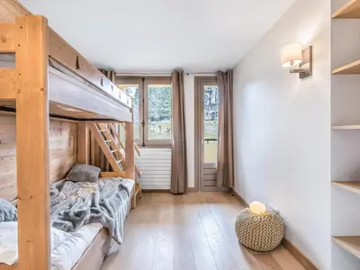 a bedroom with a bunk bed and a large window at Appartement central 2 chambres avec balcon et Wifi à Megève - FR-1-453-53 in Megève