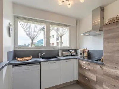 a kitchen with white cabinets and a window at Appartement 2 pièces à Megève, balcon au sud, proche centre - FR-1-453-54 in Megève
