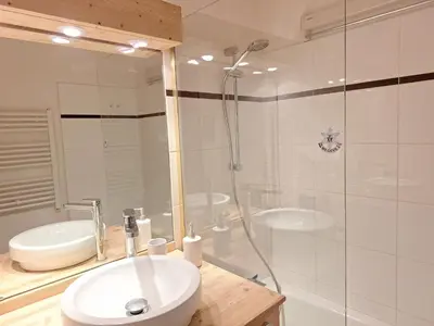 a white bathroom with a sink and a shower at Appartement 1 chambre et mezzanine à Megève avec balcon et animaux admis - FR-1-453-57 in Megève