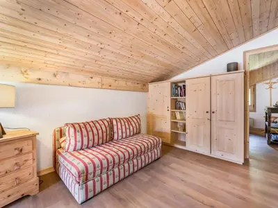 a living room with a couch and a wooden ceiling at Appartement 1 chambre et mezzanine à Megève avec balcon et animaux admis - FR-1-453-57 in Megève