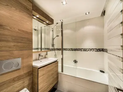 a bathroom with a tub and a sink and a shower at Studio skis aux pieds à Megève, animaux permis - FR-1-453-58 in Megève