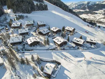 an aerial view of a resort in the snow at Studio skis aux pieds à Megève, animaux permis - FR-1-453-58 in Megève