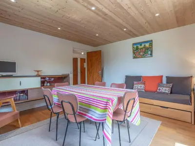 a room with a table and chairs and a couch at Appartement cosy à Megève, 1 chambre, parking, wifi - FR-1-453-59 in Megève