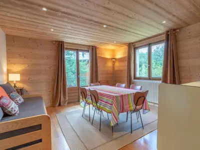 a dining room with a table and chairs in a room at Appartement cosy à Megève, 1 chambre, parking, wifi - FR-1-453-59 in Megève