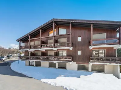 an apartment building with snow in front of it at Appartement 1 Chambre Confort à Megève - Animaux Bienvenus - FR-1-453-61 in Megève