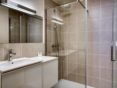 a bathroom with a sink and a shower at Appartement spacieux 1 chambre à Megève, balcon, parking inclus - FR-1-453-62 in Megève