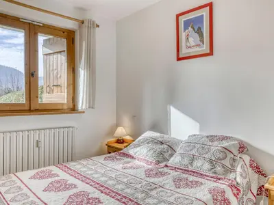 a bedroom with a bed and a window at Appartement cosy 1 chambre à Megève, animaux admis - FR-1-453-63 in Megève