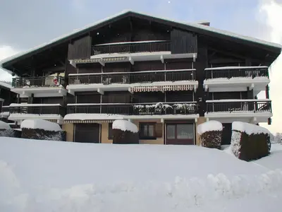 a building with snow in front of it at Appartement cosy 1 chambre à Megève, animaux admis - FR-1-453-63 in Megève