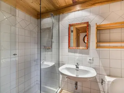 a bathroom with a sink and a shower at Appartement 3 pièces, 4 pers, Megève Mont d'Arbois, TV, Wifi - FR-1-453-76 in Megève