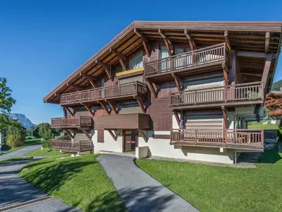 a house with balconies on the side of it at Appartement 3 pièces, 4 pers, Megève Mont d'Arbois, TV, Wifi - FR-1-453-76 in Megève