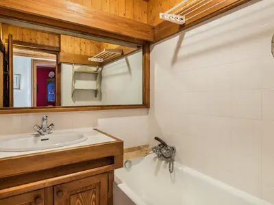 a bathroom with a sink and a bath tub at Appartement 3 pièces, 4 pers, Megève Mont d'Arbois, TV, Wifi - FR-1-453-76 in Megève