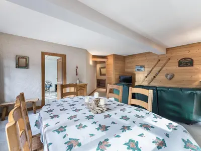 a dining room with a table and chairs in a room at Appartement 2 chambres au centre de Megève avec WiFi - FR-1-453-78 in Megève