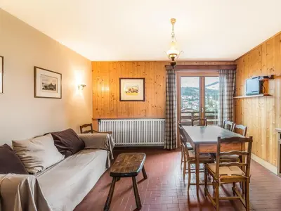 a living room with a couch and a table at Appartement 3 pièces avec balcon et wifi - Megeve Jaillet - FR-1-453-80 in Megève