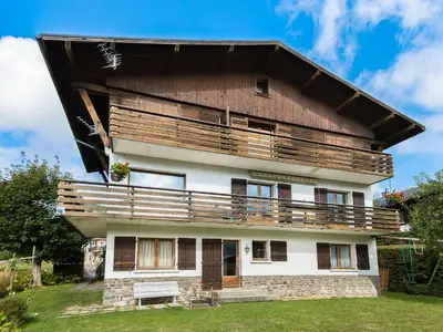 a house with a large balcony on top of it at Appartement 3 pièces avec balcon et wifi - Megeve Jaillet - FR-1-453-80 in Megève