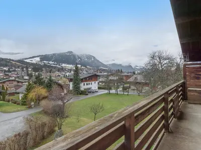 a balcony with a view of a town and mountains at Appartement 3 pièces avec balcon et wifi - Megeve Jaillet - FR-1-453-80 in Megève