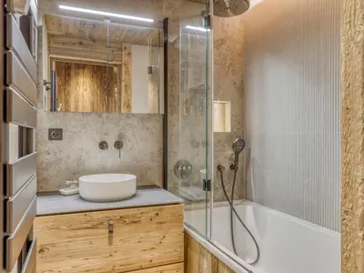 a bathroom with a tub and a sink and a shower at Charmant 2 pièces proche pistes à Megève - FR-1-453-83 in Megève