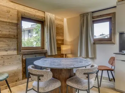 a living room with a table and chairs at Charmant 2 pièces proche pistes à Megève - FR-1-453-83 in Megève