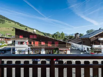 a view from a balcony of a town with buildings at Appartement confortable à Megève - Centre, 50m², 4 personnes, 3 balcons, TV et Wifi - FR-1-453-92 in Megève