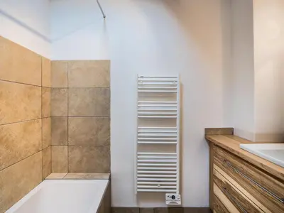 a bathroom with a shower and a tub and a sink at Charmant 3 pièces au centre de Megève, idéal 4 pers - FR-1-453-96 in Megève